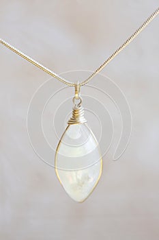 Moon stone sterling silver simple pendant on neutral background