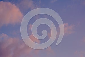 The moon and sunset colors in the sky, in Covington, Kentucky