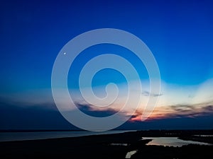 Moon in sunset flames