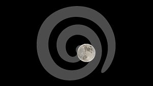 Moon time lapse, stock time lapse: full moon rise in dark nature sky, night time. Full moon disk time lapse with moon light up in