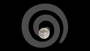 Moon time lapse, stock time lapse: full moon rise in dark nature sky, night time. Full moon disk time lapse with moon light up in