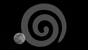 Moon timelapse, stock time lapse: full moon rise in dark nature sky, night time. Full moon disk time lapse with moon light up in