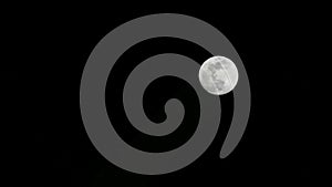 Moon timelapse, stock time lapse: full moon rise in dark nature sky, night time. Full moon disk time lapse with moon light up in
