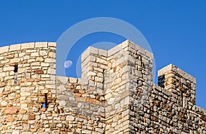 The moon between the turrets of the castle at Le Suquet, Cannes photo