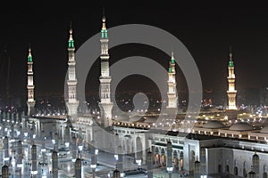 Moon between two towers of the Prophet's Mosque in Al Madinah, Saudi Arabia photo