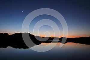 Moon and Venus over Paurotis Pond in the Everglades.