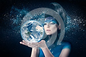 Moon woman holding planet earth