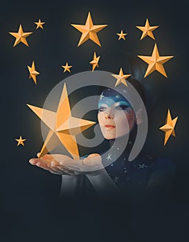 Moon woman holding stars in her hands