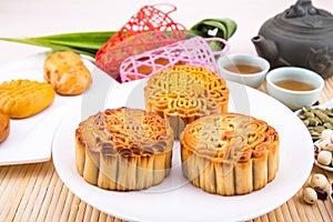 Mooncake for Chinese mid-autumn festival celebration, wih ingredients and tea.