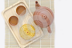 Mooncake with tea on white background