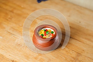 Moondi rabri milk kheer served in pot isolated on mat top view of indian, bangali and pakistani dessert mithai