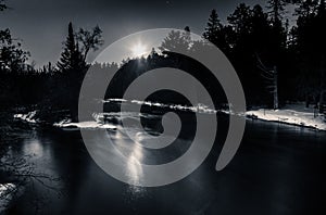 Moonlight Reflection over Winter River Snow on Banks