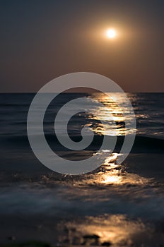 Moonlight on the sea waves. Night Moon. Long exposure