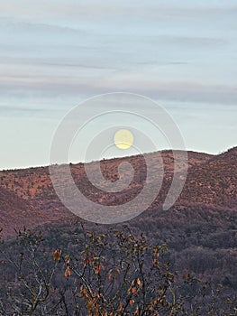 Moonlight and sunset over the mountain