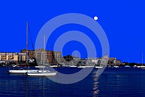 Moonrise and boats in New York Harbor