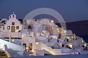 Moonrise at evening at Oia Santorini Greece