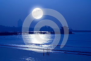 Moonrise over the seaside photo