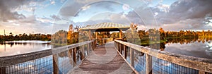 Moonrise at Sunset over Gazebo on a wooden secluded, tranquil boardwalk