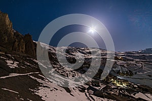Moonrise in Winter spiti over village in himalayas - spiti valley