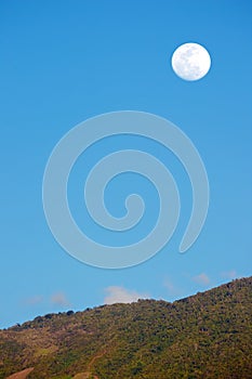 Moonset over the blue Sky