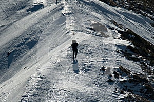 Moonwalker in mountains. Winter scenery.