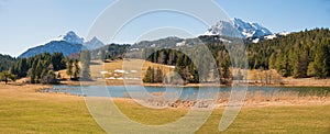 Moor lake Schmalensee, idyllic mountain landscape at early springtime, view to Wetterstein alps