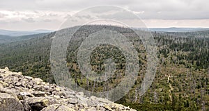Moorberg (Velka Mokruvka) hill from Lusen hill with blockfield in Bavarian Forest mountains in Germany photo