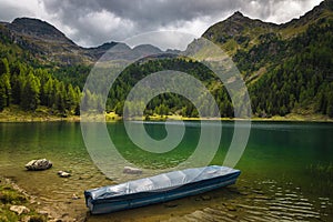 Moored boat on the lake in the mountains, Austria photo