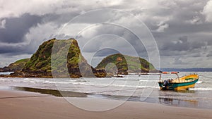 Moored boat used to take tourists to see penguins in the protected area of the Punihuil islets in the island of ChiloÃ©, Chile