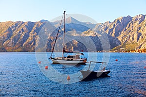 Moored boat and yacht in the bay