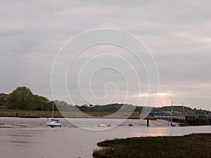 Moored boats and yachts at low tide on Wivenhoe Estuary in Essex