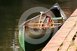 Moored canoe and lifevest photo