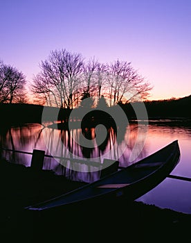 Moored Canoe by a Twilight Lake