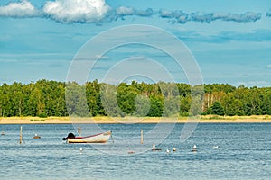 Moored empty fishing boat with motor at Kattegat sea in Halmstad, Sweden