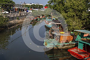 Moored fishing boats on a little river in Ham Ninh on Phu Quoc Island Vietnam