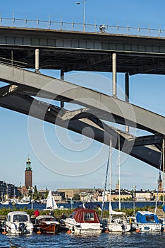 Moored leisureboats under VÃÂ¤sterbron bridge Stockholm