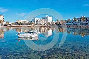 Moored llaut with reflections