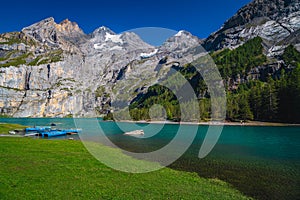 Moored rowing boats on the lake Oeschinensee, Bernese Oberland, Switzerland
