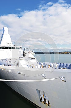 Moored white naval ship.
