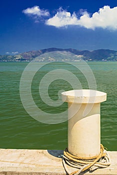 Mooring a boat to a pier.