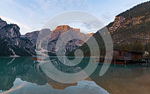 Mooring of boats on Lake Braies at first light in the morning