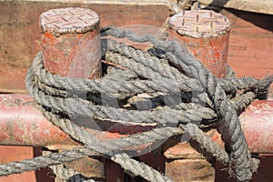 Mooring Bollard with rope on pier by the sea