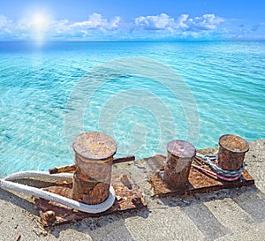 Mooring bollards with ship ropes.