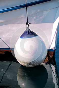 Mooring buoy against a fishing boat