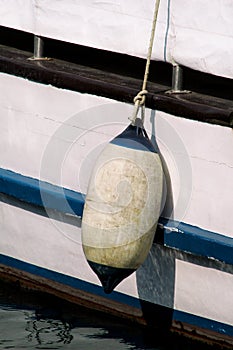 Mooring buoy against a fishing boat