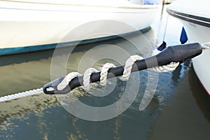 Mooring compensator of rope tension. Detail of boat.