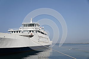 Mooring lines and a ferry at the Port of Thassos, Greece. photo