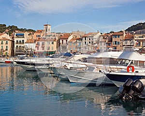 Mooring for motor boats in Cassis and view of the city