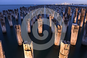 Mooring poles at night at Princes Pier