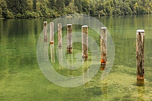 Mooring poles at St Bartholoma pier. Konigssee. Germany